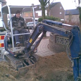 aanleg riolering graafmachine